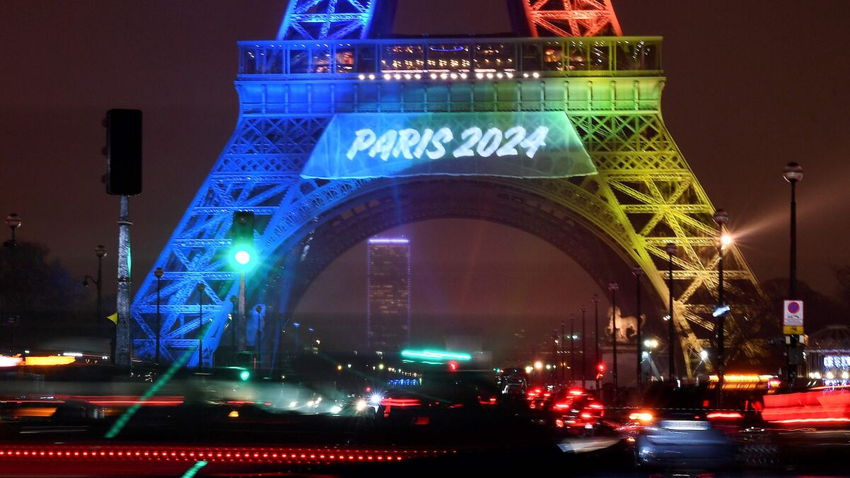 Olympic colors adorn the Eiffel Tower in Paris.