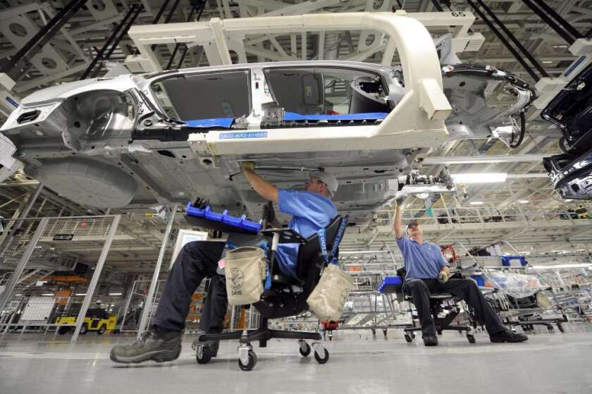 Workers at an auto assembly plant in Tennessee. Nationwide, employer compensation costs, which include wages and benefits, rose only 0.4% in the third quarter.
