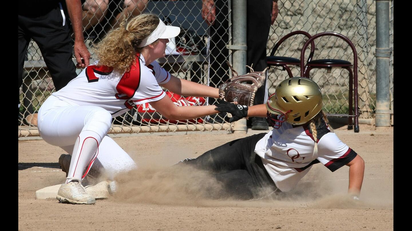 Burroughs' Brianna Johnson reaches for the tag as Oaks Christian's Kaitlin Simonsgaard slides into home during a CIF playoff game on Thursday, May 18, 2017.