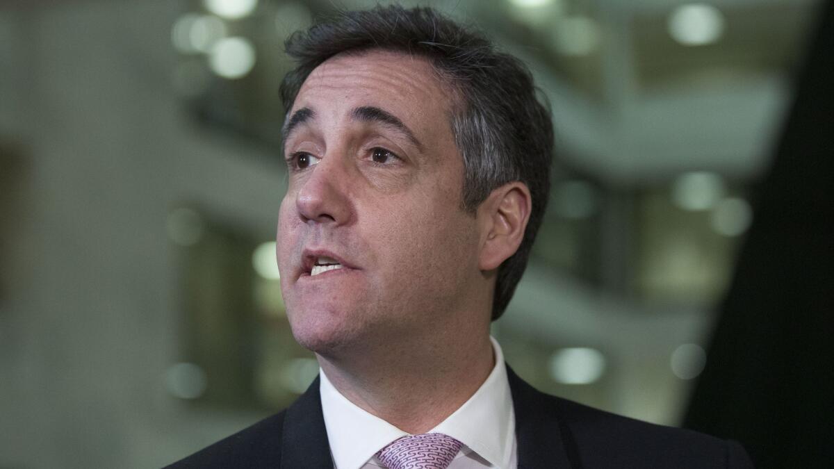 Michael Cohen, President Trump's former lawyer, speaks to the media after testifying at a closed-door hearing of the Senate Intelligence Committee on Tuesday.