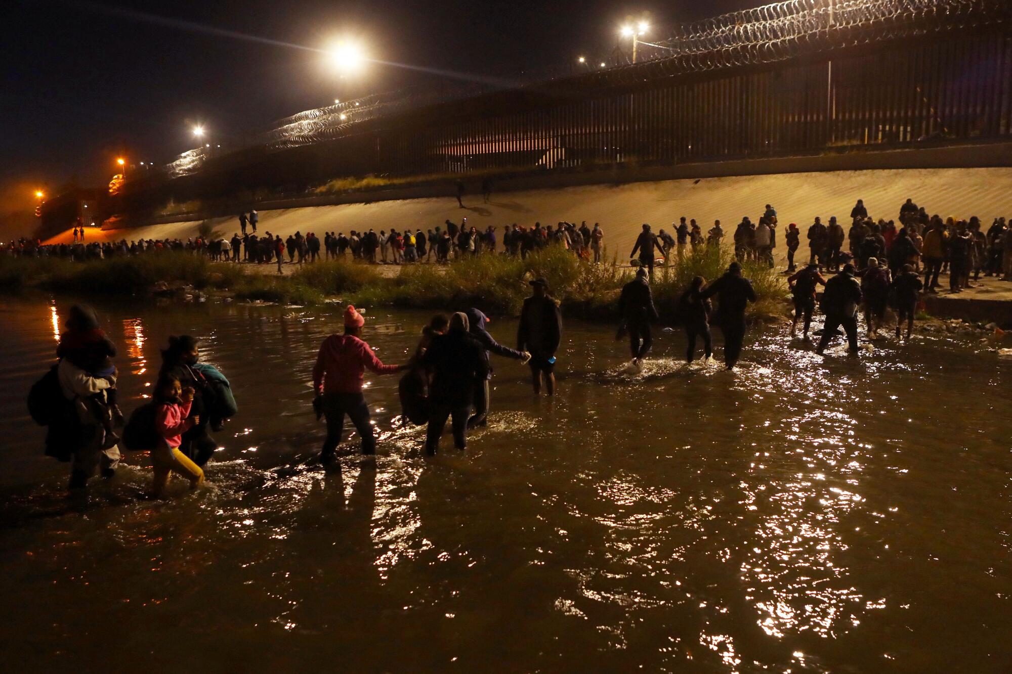  Migrants cross the Rio Grande in  Ciudad Juarez.