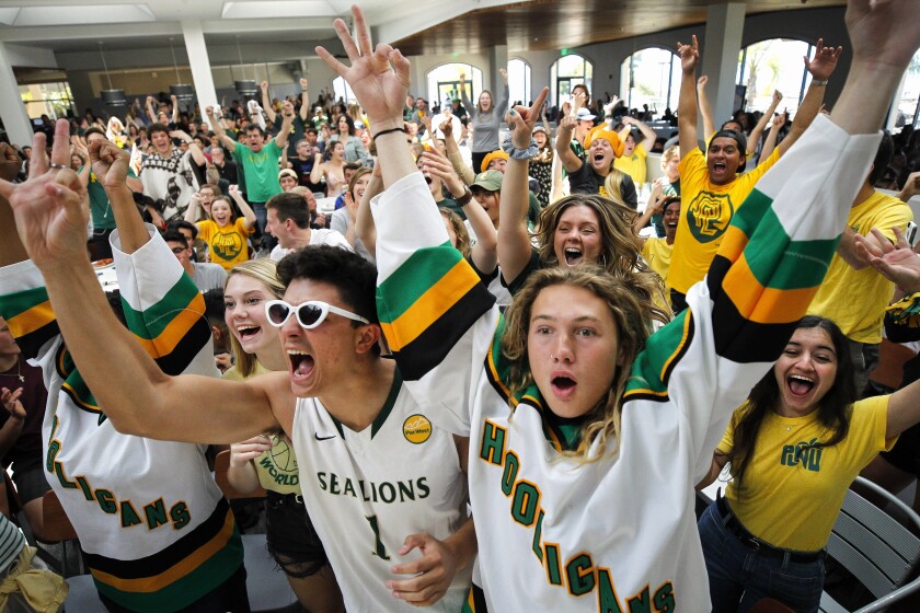 Point Loma Nazarene students cheer the Sea Lions in a watch party during the 2019 NCAA Div. II basketball championship.