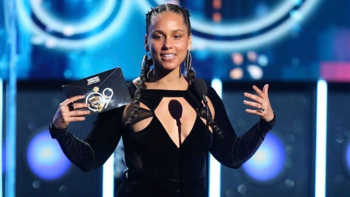 Alicia Keys, photographed here presenting at the 2018 Grammy Awards, will host the 2019 ceremony next month.