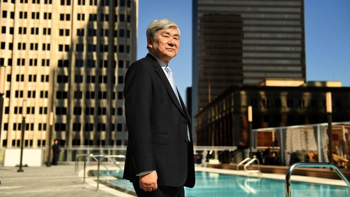 Yang-Ho Cho stands next to the pool at the Wilshire Grand Center in downtown Los Angeles in June 2017.