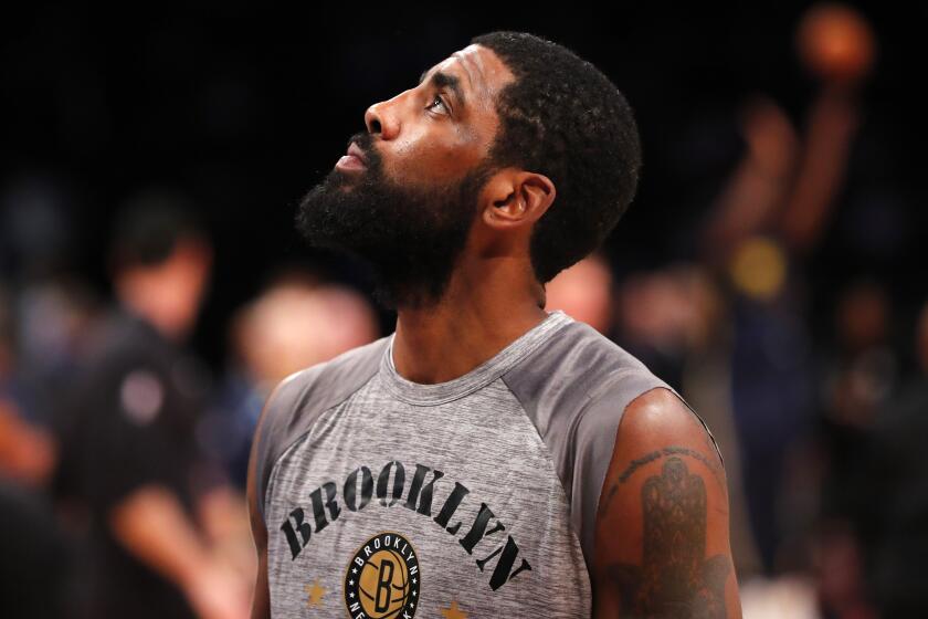 Brooklyn Nets guard Kyrie Irving (11) looks up during warm ups 