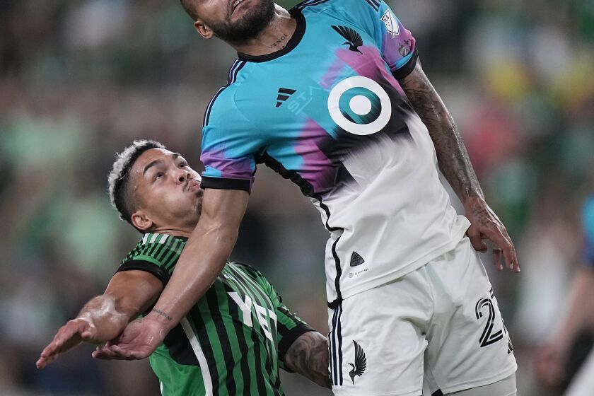 Minnesota United defender D.J. Taylor (27) works with the ball next to Austin FC midfielder Daniel Pereira, left, during the second half of an MLS soccer match Wednesday, May 31, 2023, in Austin, Texas. (AP Photo/Eric Gay)