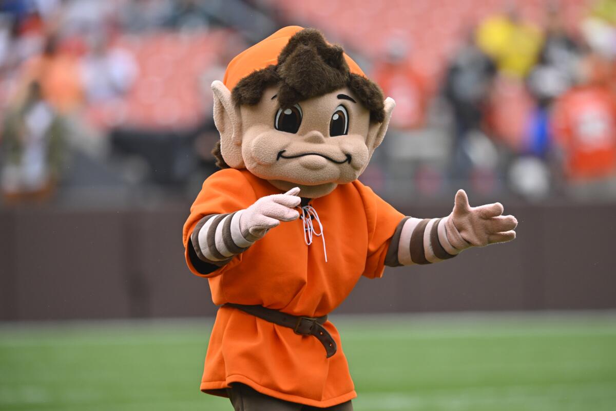 Cleveland Browns mascot Brownie the Elf walks on the field 