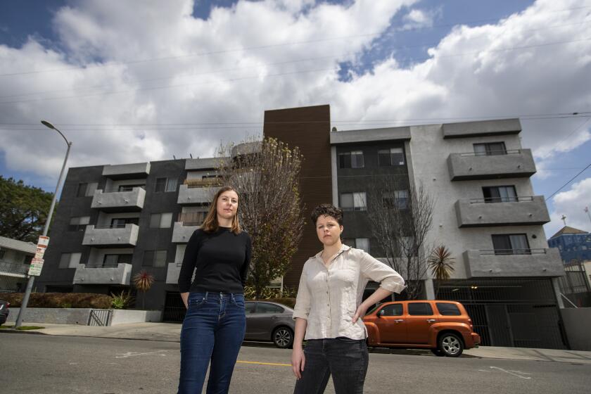 LOS ANGELES, CA -- SATURDAY, APRIL 4, 2020: Simona Boneva, left, and roommate Gayle Curry stand outside their East Hollywood apartment Saturday, April 4, 2020. Boneva was pressured by her landlord, Rom Residential, to agree to a rent repayment plan more onerous than what the city of Los Angeles required - including being asked to turn over her stimulus check. (Allen J. Schaben / Los Angeles Times)