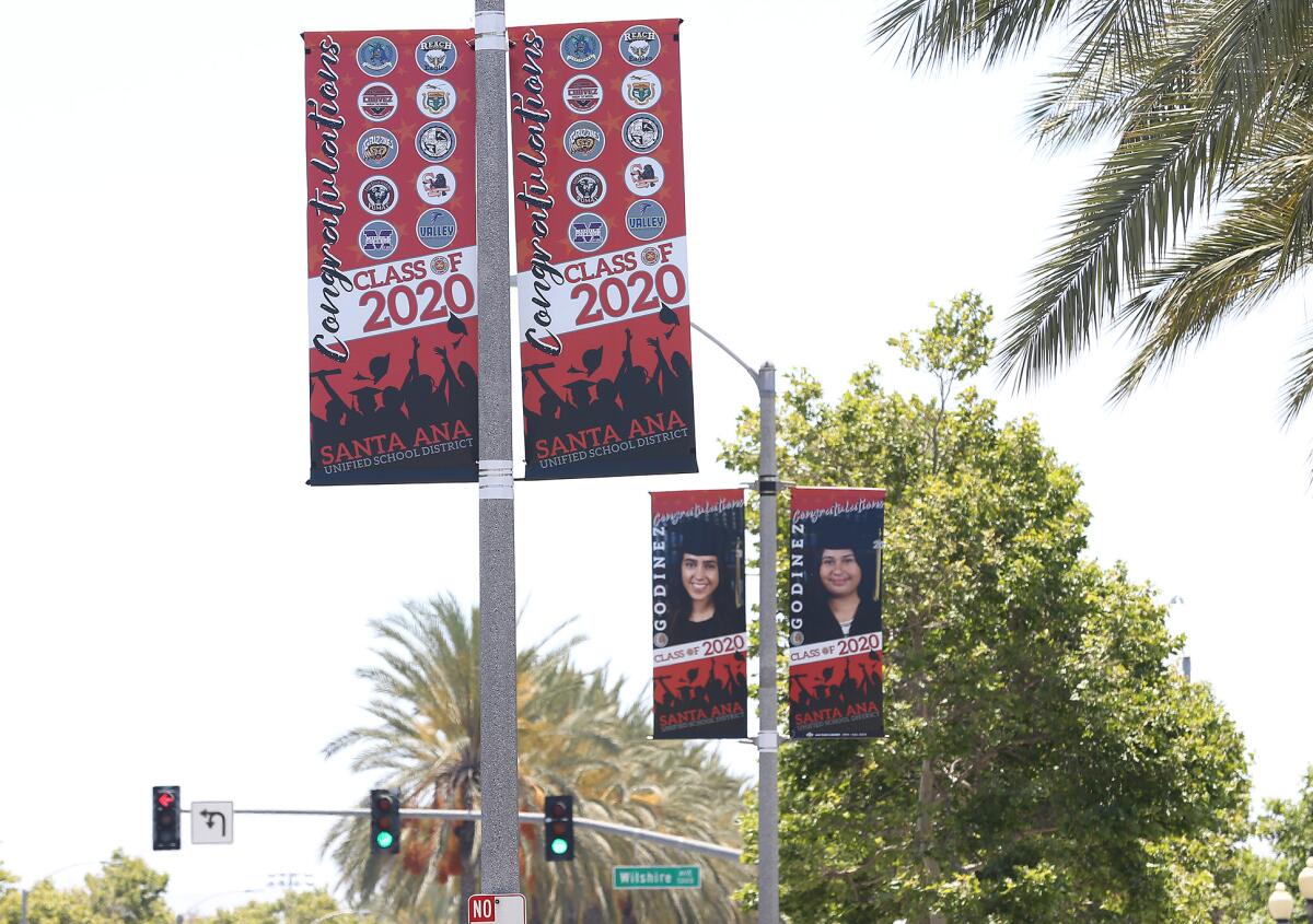 Banners celebrating 2020 graduates in Santa Ana.