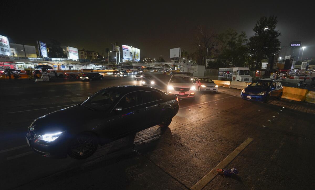Cars wait in line at the San Ysidro Port of Entry on Monday in Tijuana.