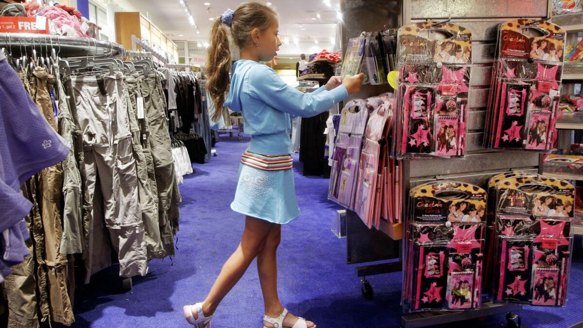 A young girl shops for back-to-school items at Limited Too in 2006.