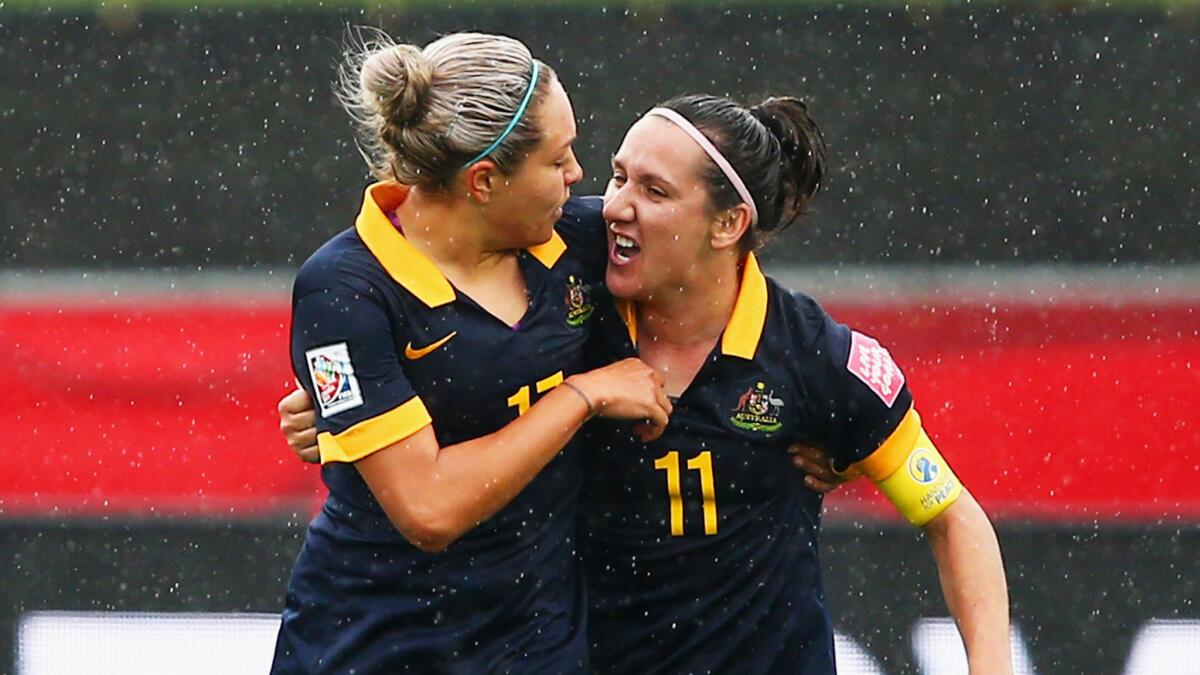 Australia's Kyah Simon, left, celebrates with teammate Lisa De Vanna after scoring during a 1-0 knockout round victory over Brazil at the women's World Cup in Canada on Sunday.
