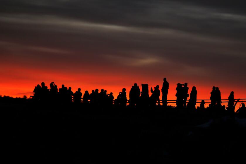 The Grand Canyon drew nearly 6 million visitors in 2016. Here, throngs wait for sunrise at Mather Point on the canyon's South Rim.