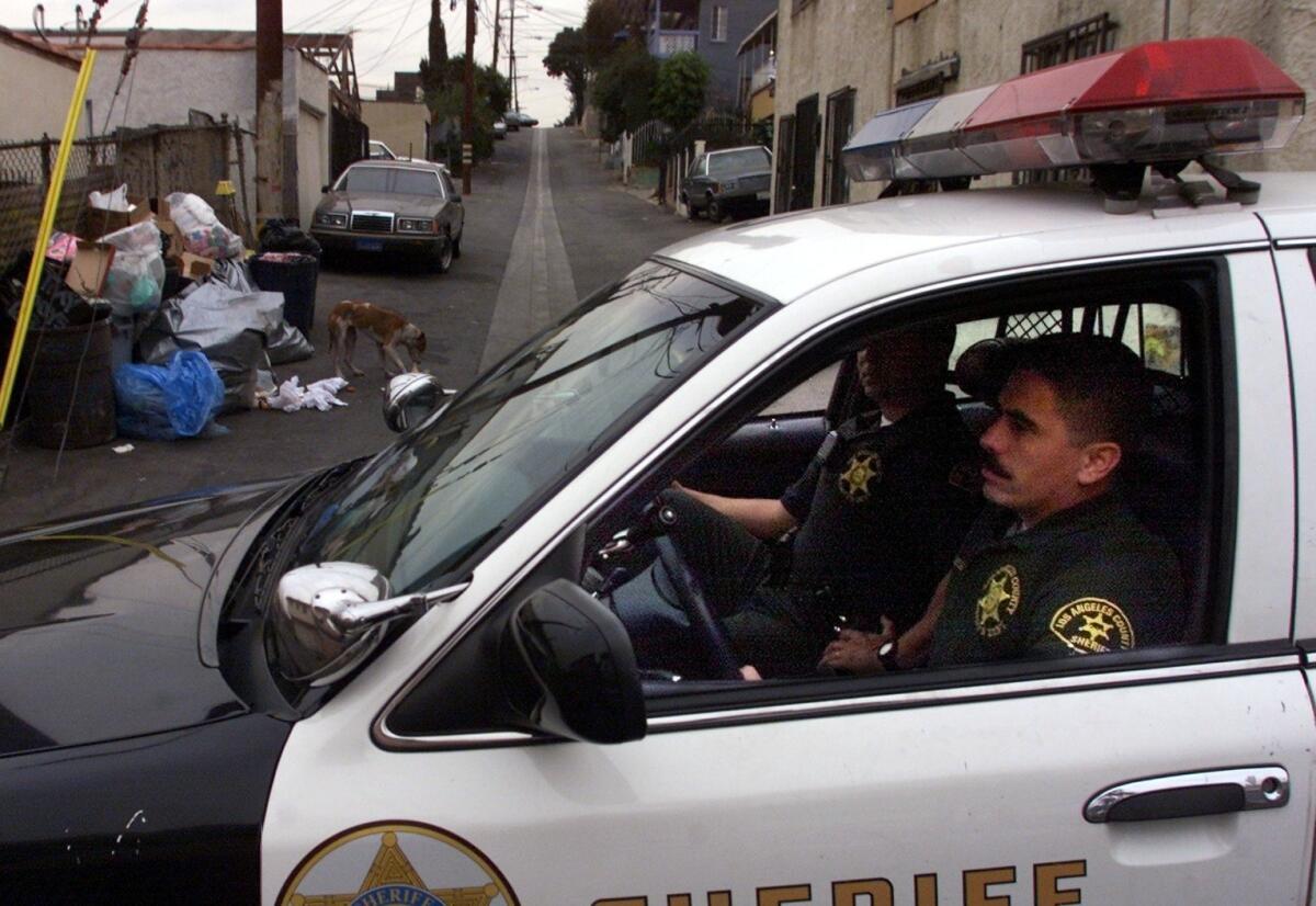 L.A. County sheriff's Deputies Oscar Barragan and Ron Navarrete patrol in the City Terrace area.