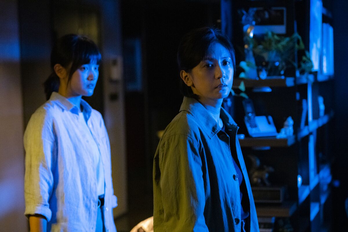 A teenage girl and her mother in the movie "The Falls."
