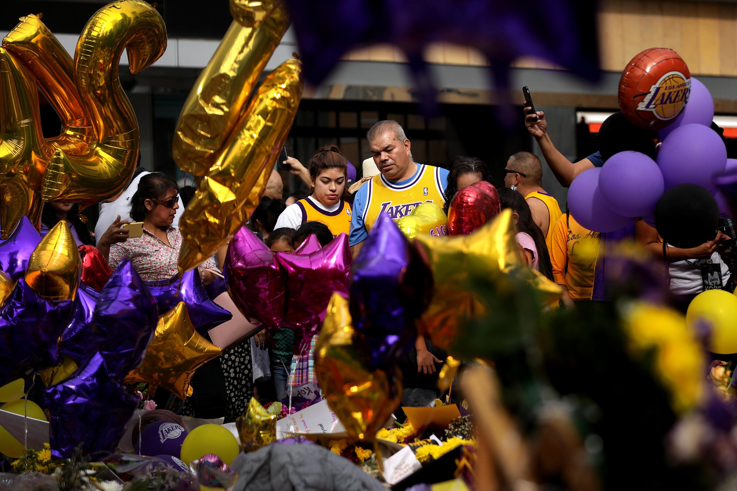 LOS ANGELES-CA-FEBRUARY 2, 2020: Fans gather at a memorial for Kobe Bryant at L.A. Live on Sunday, February 2, 2020. (Christina House / Los Angeles Times)