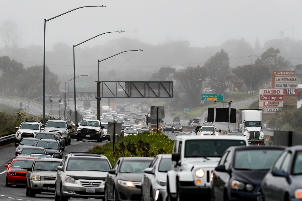 Traffic forms after flooding causes closures along SR-78 on Wednesday in Oceanside.