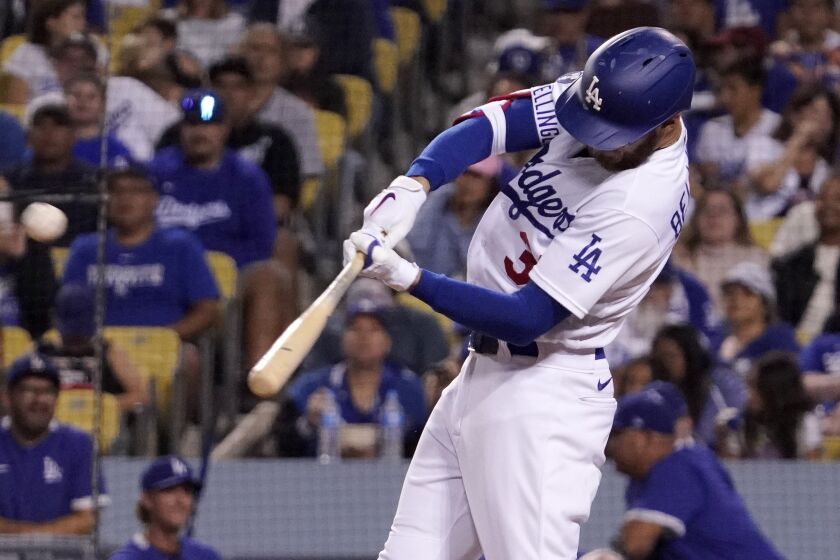 Los Angeles Dodgers' Cody Bellinger hits a three-run home run during the fourth inning.