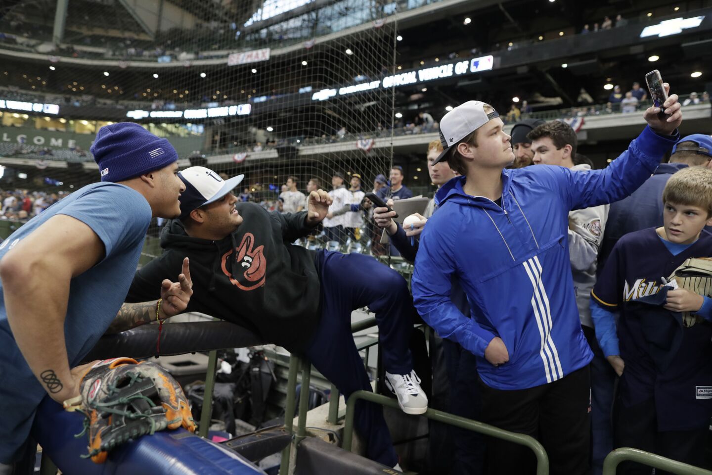 Fans take photos with Manny Machado before Game 7.