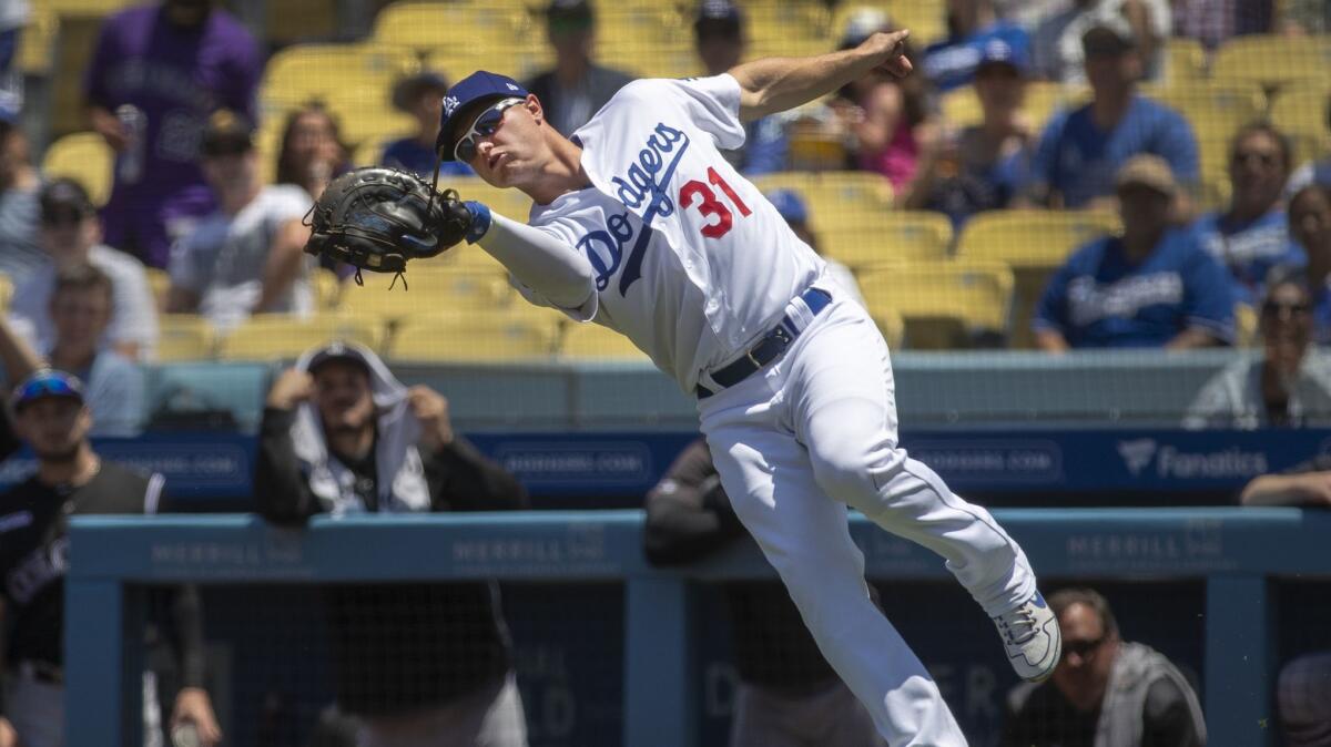 Dodgers first baseman Joc Pederson reaches to catch a pop fly in the second inning at Dodger Stadium on June 23.