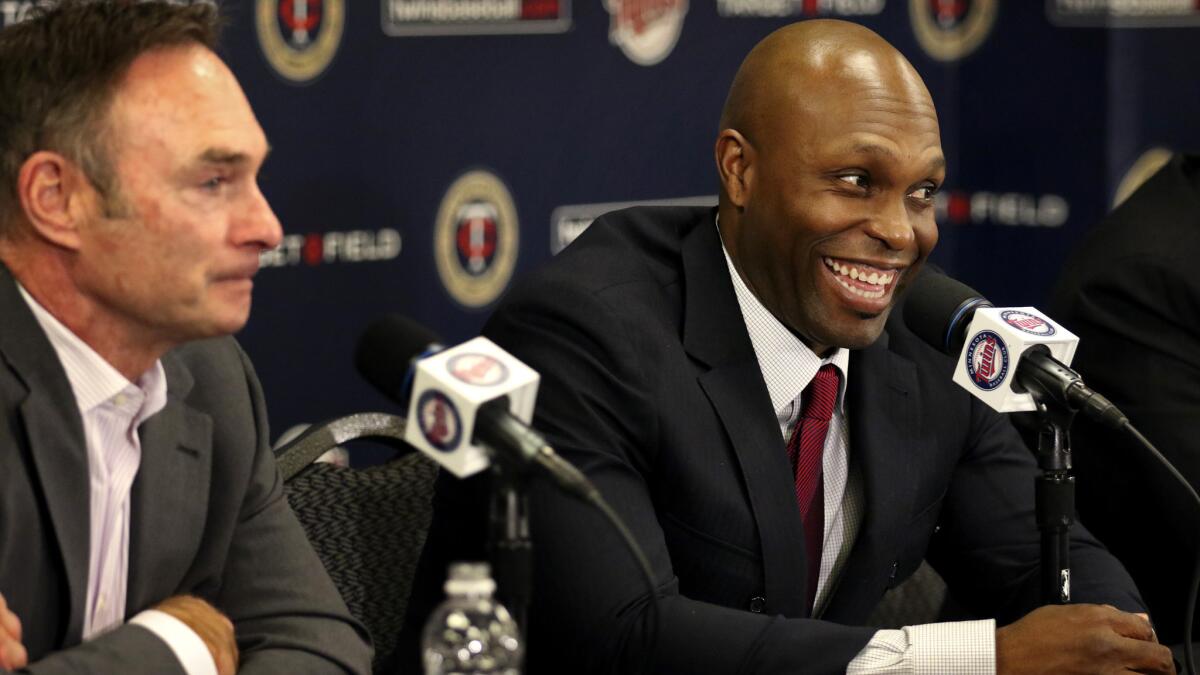 Twins outfielder Torii Hunter is all smiles as he sits next to Manager Paul Molitor during a news conference to announce his retirement Thursday.