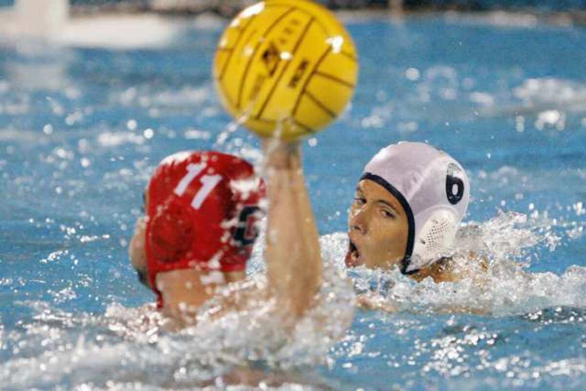 Glendale's David Papazian, left, looks for an open pass while Pasadena Poly's Chris McWilliams defends.
