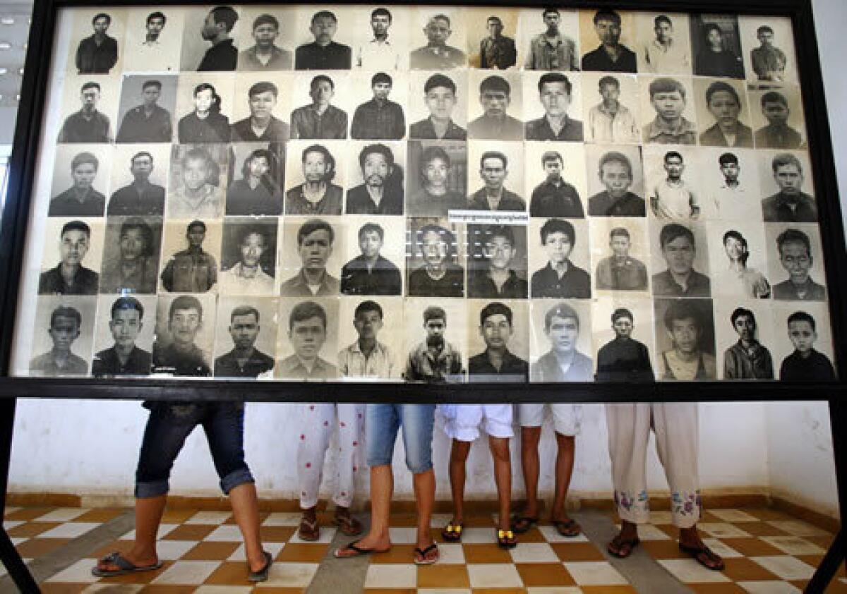 A display of photos of Cambodians killed by the Khmer Rouge at Tuol Sleng, a former prison turned genocide museum in Phnom Penh. Nearly 2 million people are thought to have died during the Khmer Rouge's four-year reign of terror that ended in 1979 with the invasion of Cambodia by Vietnam.