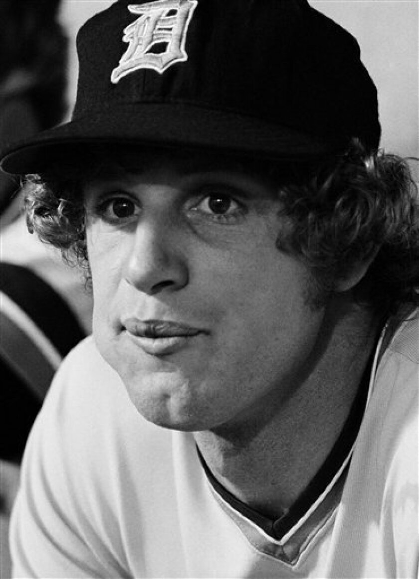 In this Aug. 10, 1976 file photo, Detroit Tigers' pitcher Mark Fidrych, is shown sitting in the Tigers dugout before a game on in Detroit, Mich. Fidrych has been found dead in an apparent accident at his farm in Northborough, Mass. on Monday, April 13, 2009. He was 54. Mark "The Bird" Fidrych was the American League rookie of the year in 1976 when he went 19-9 with a 2.34 earned run average. He spent all five of his major league seasons with the Detroit Tigers, compiling a 29-19 record and a 3.10 ERA. (AP Photo)