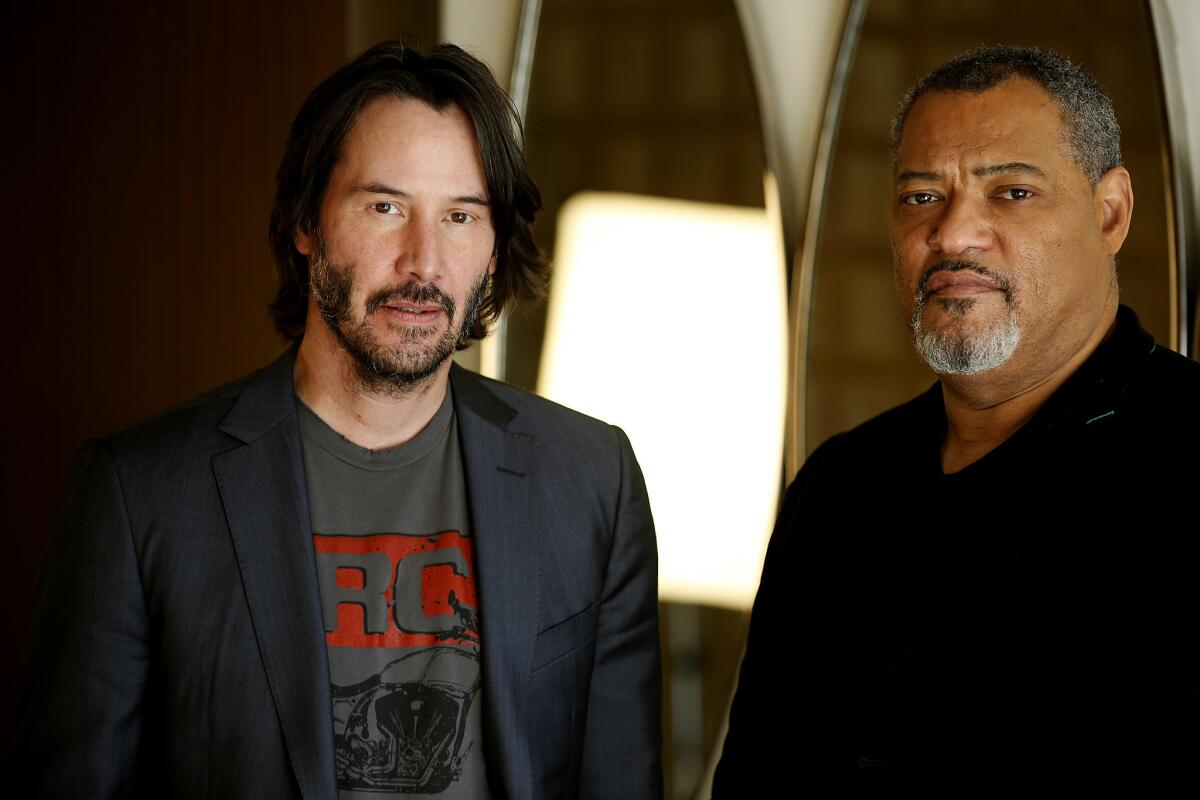 Keanu Reeves, left, and Laurence Fishburne, who costarred in the "Matrix" franchise, reunite in their new action movie "John Wick: Chapter 2," opening Feb. 10. The two were photographed at the London Hotel on Jan. 27.