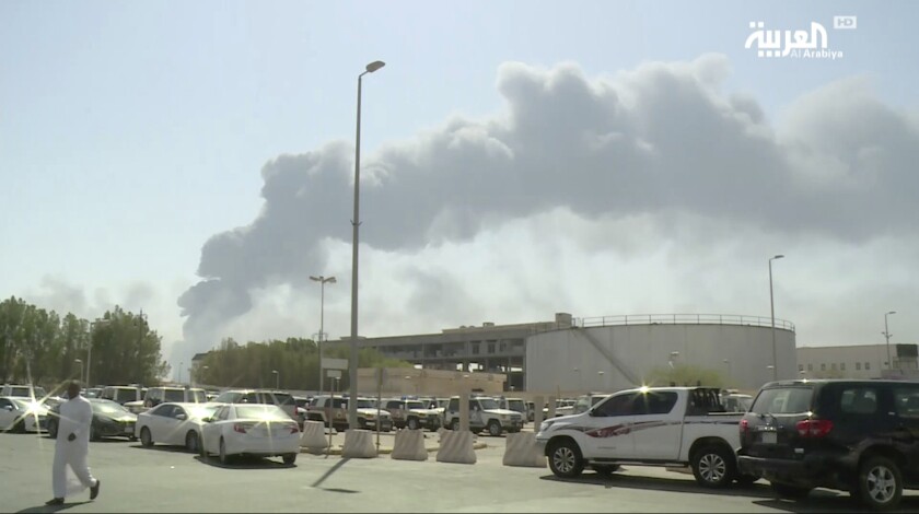 A photo taken from a video broadcast on the Saudi-owned satellite news channel Al-Arabiya shows smoke from a fire at the Abqaiq oil processing facility in Buqayq, Saudi Arabia.