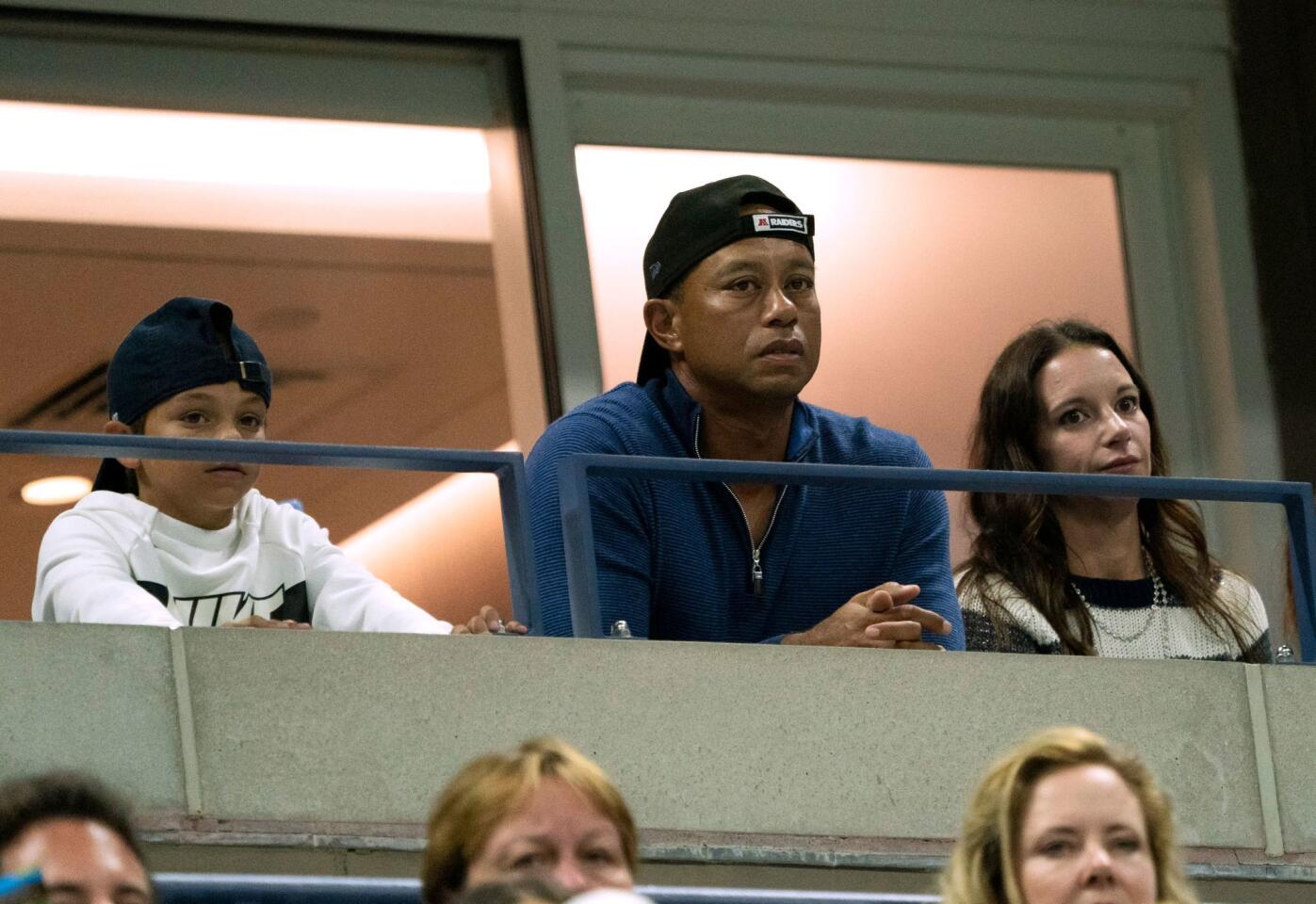 U.S. golfer Tiger Woods watches the match between Rafael Nadal of Spain and Marin Cilic of Croatia during their Round Four Men's Singles match at the 2019 US Open at the USTA Billie Jean King National Tennis Center in New York on Sept. 2, 2019.