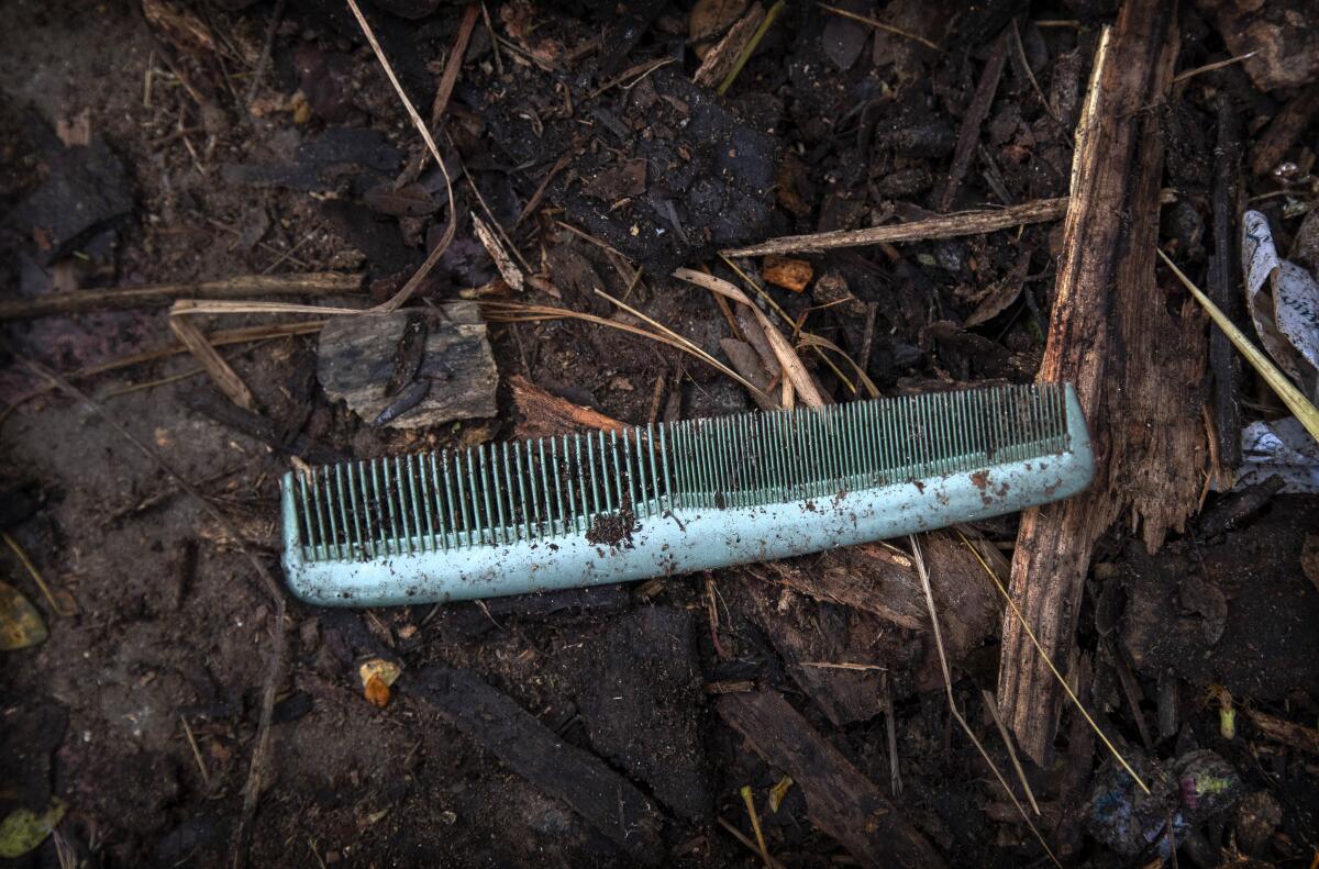 A comb of a deceased COVID-19 victim lies in a cremation ground in Gauhati, India, Friday, July 2, 2021. The personal belongings of cremated COVID-19 victims lie strewn around the grounds of the Ulubari cremation ground in Gauhati, the biggest city in India’s remote northeast. It's a fundamental change from the rites and traditions that surround death in the Hindu religion. And, perhaps, also reflects the grim fears grieving people shaken by the deaths of their loved ones — have of the virus in India, where more than 405,000 people have died. (AP Photo/Anupam Nath)
