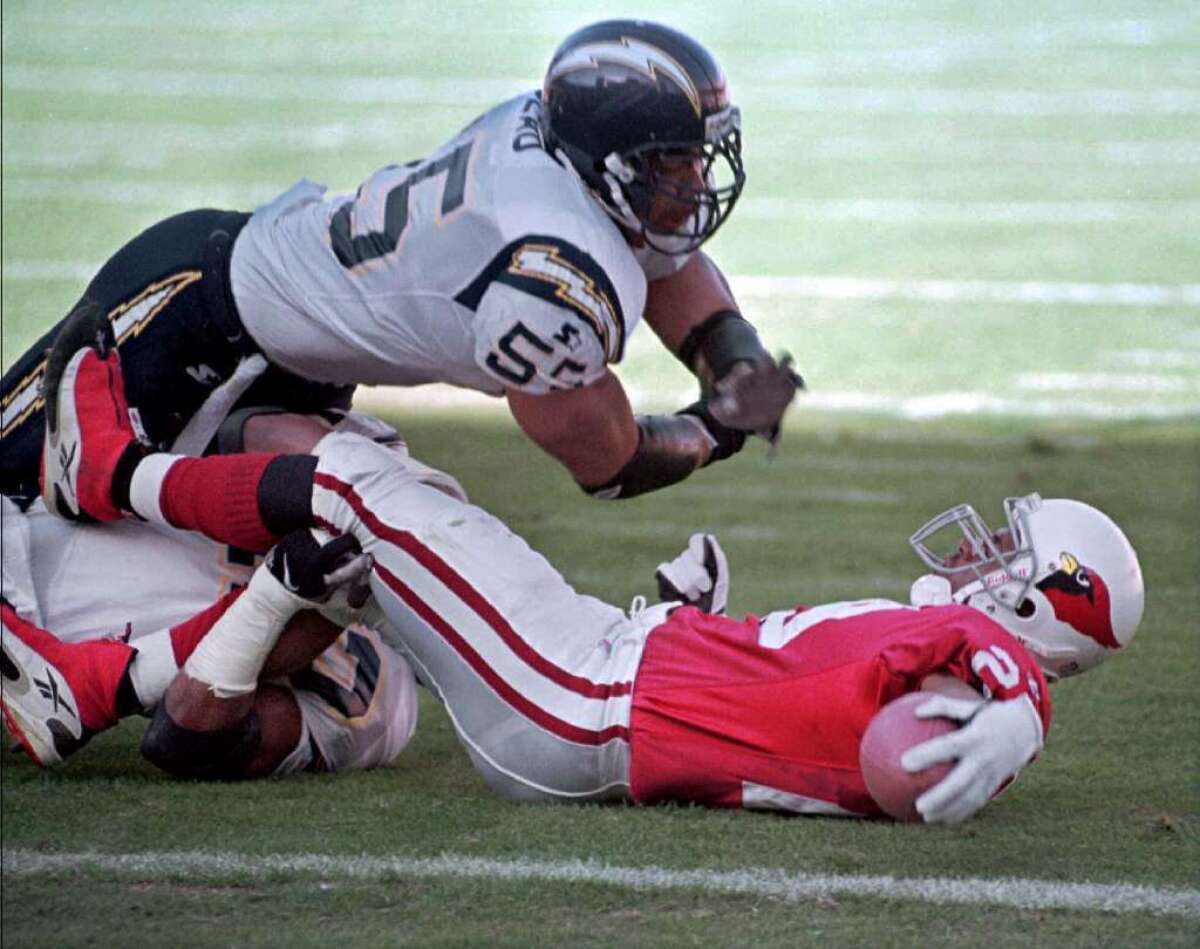 In the wake of growing scientific evidence that football puts players at risk of concussion-related brain injuries, the National Football League settled a landmark lawsuit from players on Aug. 29. The family of Junior Seau, top, who was found to have chronic traumatic encephalopathy after he committed suicide, was among the plaintiffs. MORE