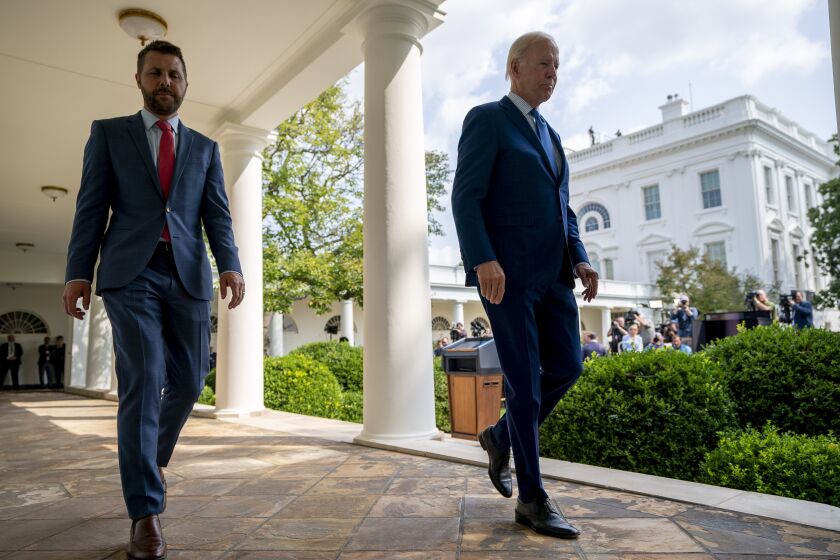 President Joe Biden walks to the Oval Office with National Economic Council director Brian Deese, left, after speaking about a tentative railway labor agreement in the Rose Garden of the White House, Thursday, Sept. 15, 2022, in Washington. (AP Photo/Andrew Harnik)