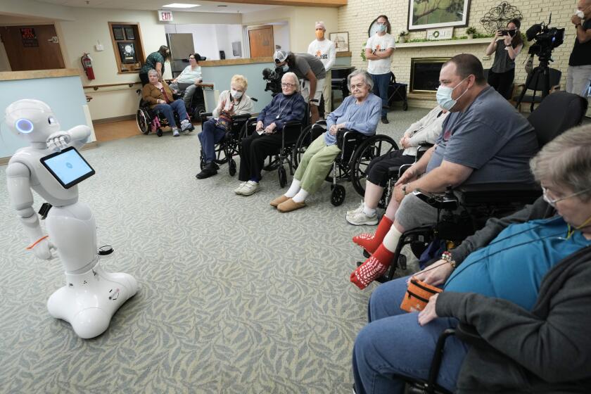 ROSEVILLE, MN. - JULY 2022: Nursing home residents were introduced to Pepper, a new robotic assistant Wednesday, July 6, 2022 in Roseville, Minn. Monarch Healthcare Management, the facility owner, is partnering with researchers from the University of Minnesota Duluth to roll out robots that will help entertain residents and assist nurses in monitoring basic vital information. (Photo by Mark Vancleave/Star Tribune via Getty Images)