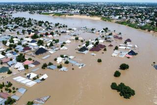 FILE - Houses and buildings are partially submerged following a dam collapse in Maiduguri, Nigeria, Tuesday, Sept 10, 2024. 281 inmates in northeastern Nigeria escaped after devastating floods brought down a prison's walls, authorities said Sunday. The correctional officers found out about the escape as they were about to evacuate the prison in Maiduguri, Borno State, due to the floods, Umar Abubakar, spokesperson for the Nigeria Correctional Services said in a statement. The collapse of a major dam in the state of Borno last week caused some of the state’s worst flooding since the same dam collapsed 30 years ago, and prompted many residents to flee their homes. The state government said the dam was at capacity due to unusually high rains. (AP Photos/ Musa Ajit Borno, File)