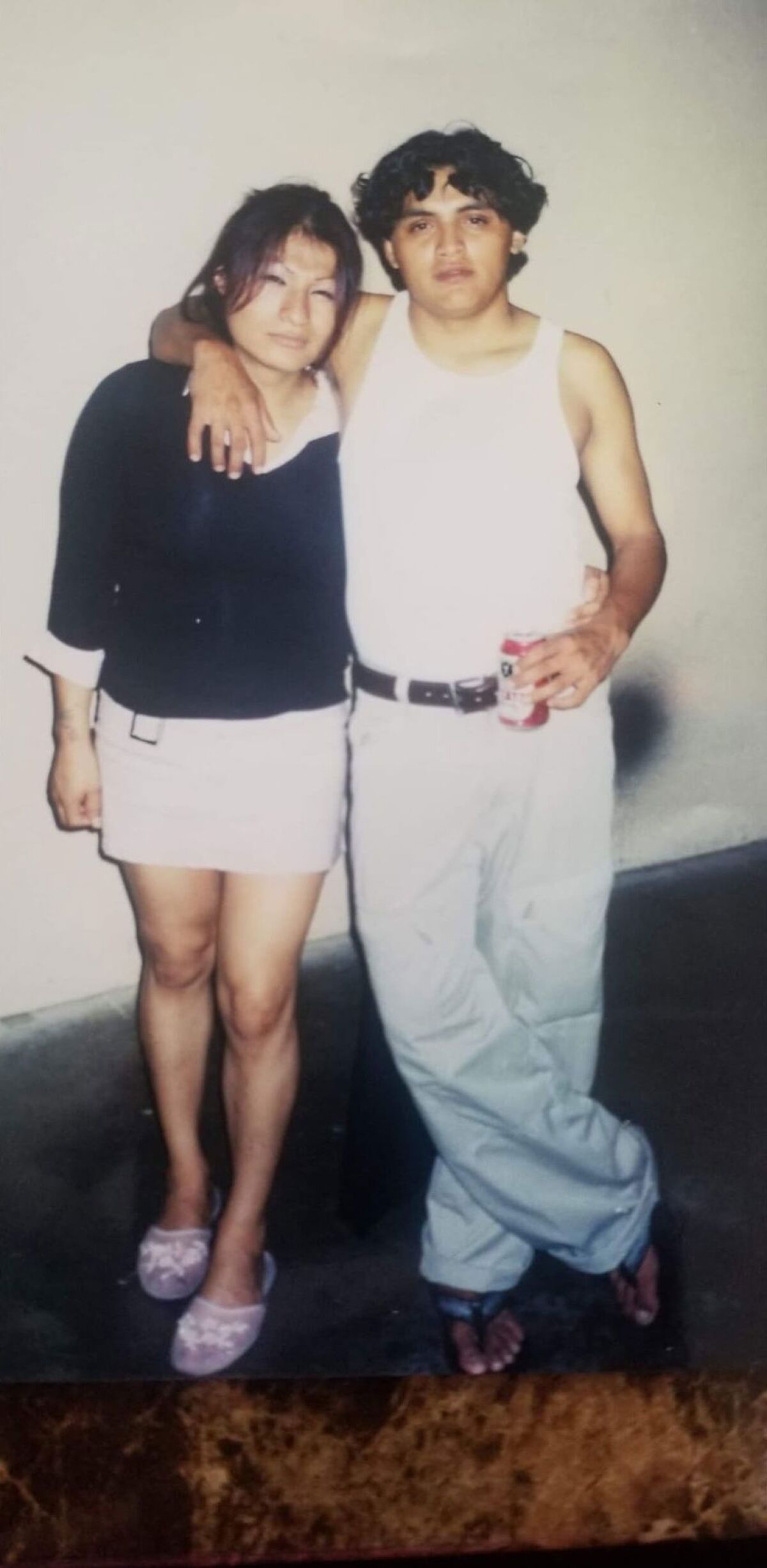 Angela Martinez and Victor Mina pose for a photo at Martinez's birthday party in 2004.