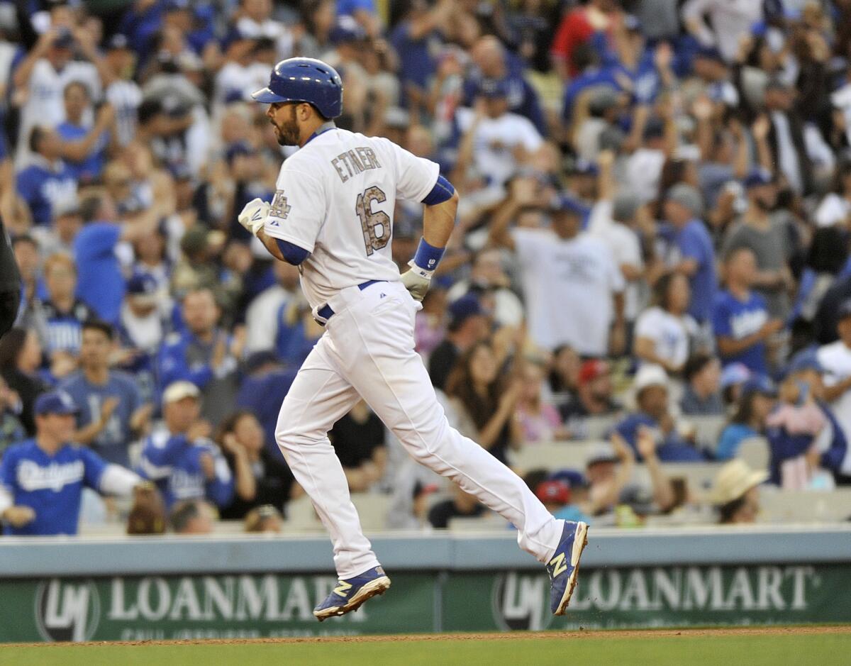 Dodgers outfiedler Andre Ethier rounds the bases after hitting the go-ahead home run against the Braves during the eighth inning.