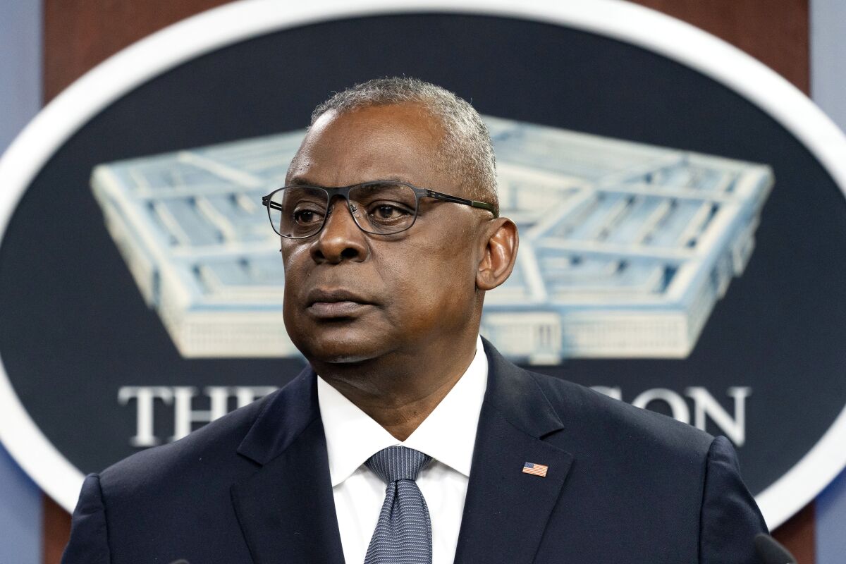 FILE - Secretary of Defense Lloyd Austin pauses while speaking during a media briefing at the Pentagon on Nov. 17, 2021, in Washington. Oklahoma's Republican governor and the state attorney general are suing in federal court to exempt the state's National Guard from a Biden administration COVID-19 vaccine mandate. Gov. Kevin Stitt argued in a statement Thursday, Dec. 2, 2021, that the Biden administration's Defense Department overstepped its constitutional authority by subjecting the National Guard to the mandate it imposed on the active-duty military. (AP Photo/Alex Brandon, File)