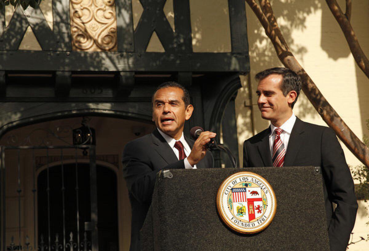 Mayor Antonio Villaraigosa, left, and Mayor-elect Eric Garcetti address the media after meeting over breakfast to talk about their transition at Getty House, the official residence of the mayor.