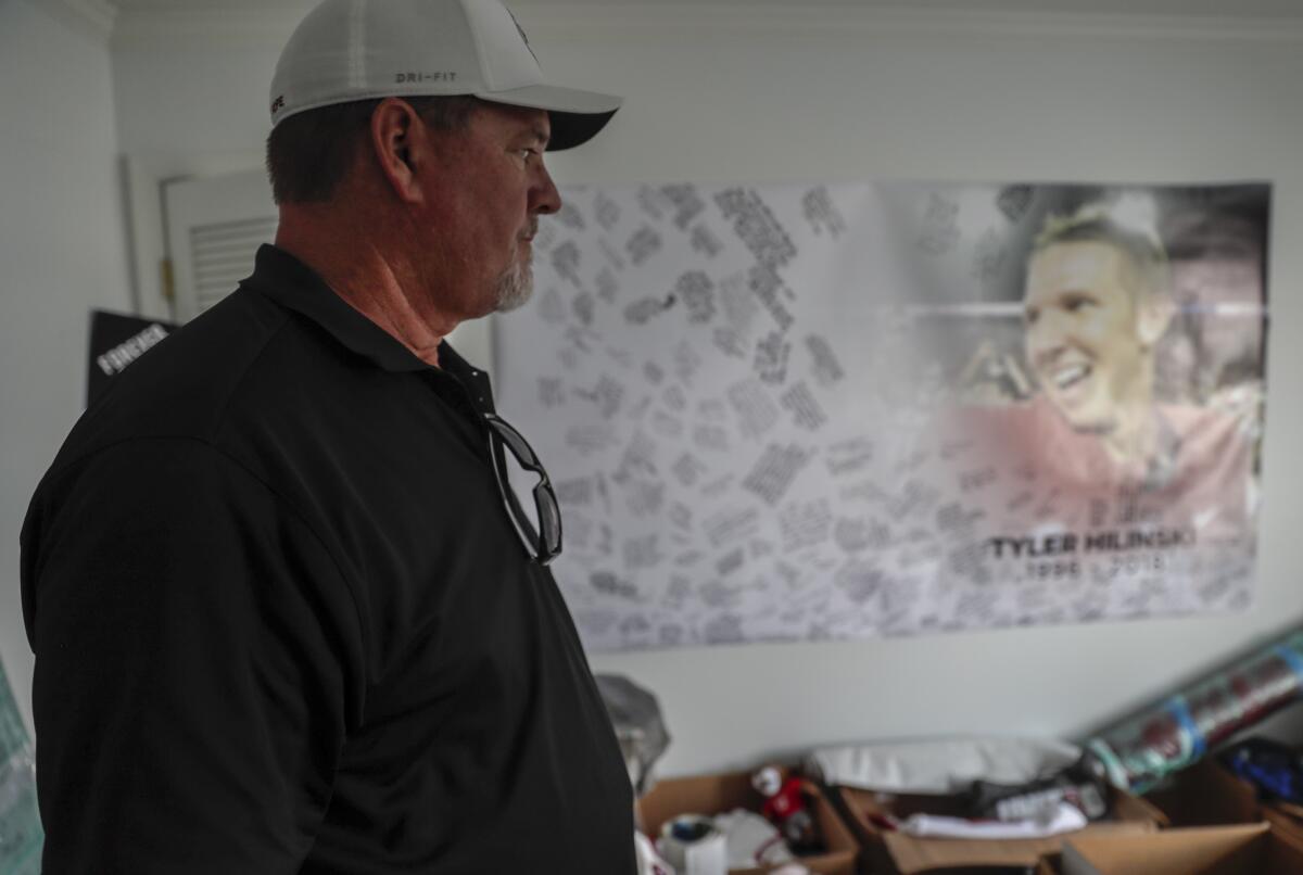 Mark Hilinski looks in on a bedroom where memorabilia of his son Tyler, a star quarterback at Washington State University is stored.