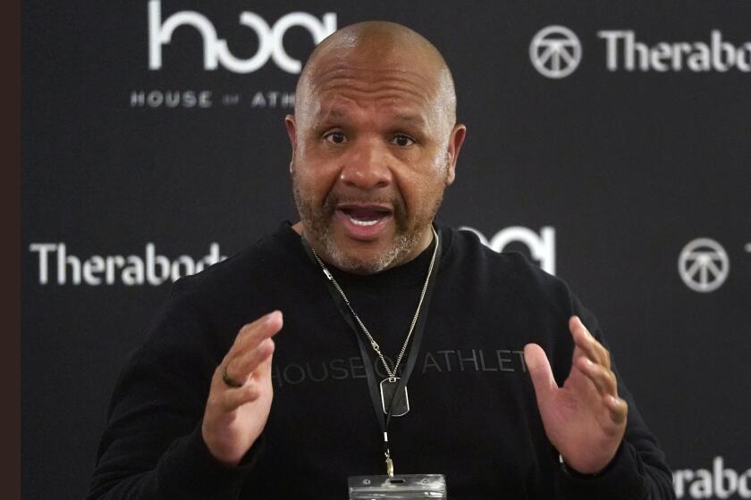 FILE - Former Cleveland Browns head coach Hue Jackson speaks during the first day of the House of Athlete Scouting Combine in Plantation, Fla., in this Wednesday, March 3, 2021, file photo. Jackson said owner Jimmy Haslam gave him a contract extension midway through a winless season and that he was lied to about the team's rebuilding plans. During a wide-ranging interview Monday, March 29, 2021, on ESPN 850, Jackson, who went 0-16 in 2017 and 3-36-1 in two-plus seasons with the Browns before being fired, said the team's efforts to improve while he was with the team were flawed by philosophical differences.(AP Photo/Wilfredo Lee, File)