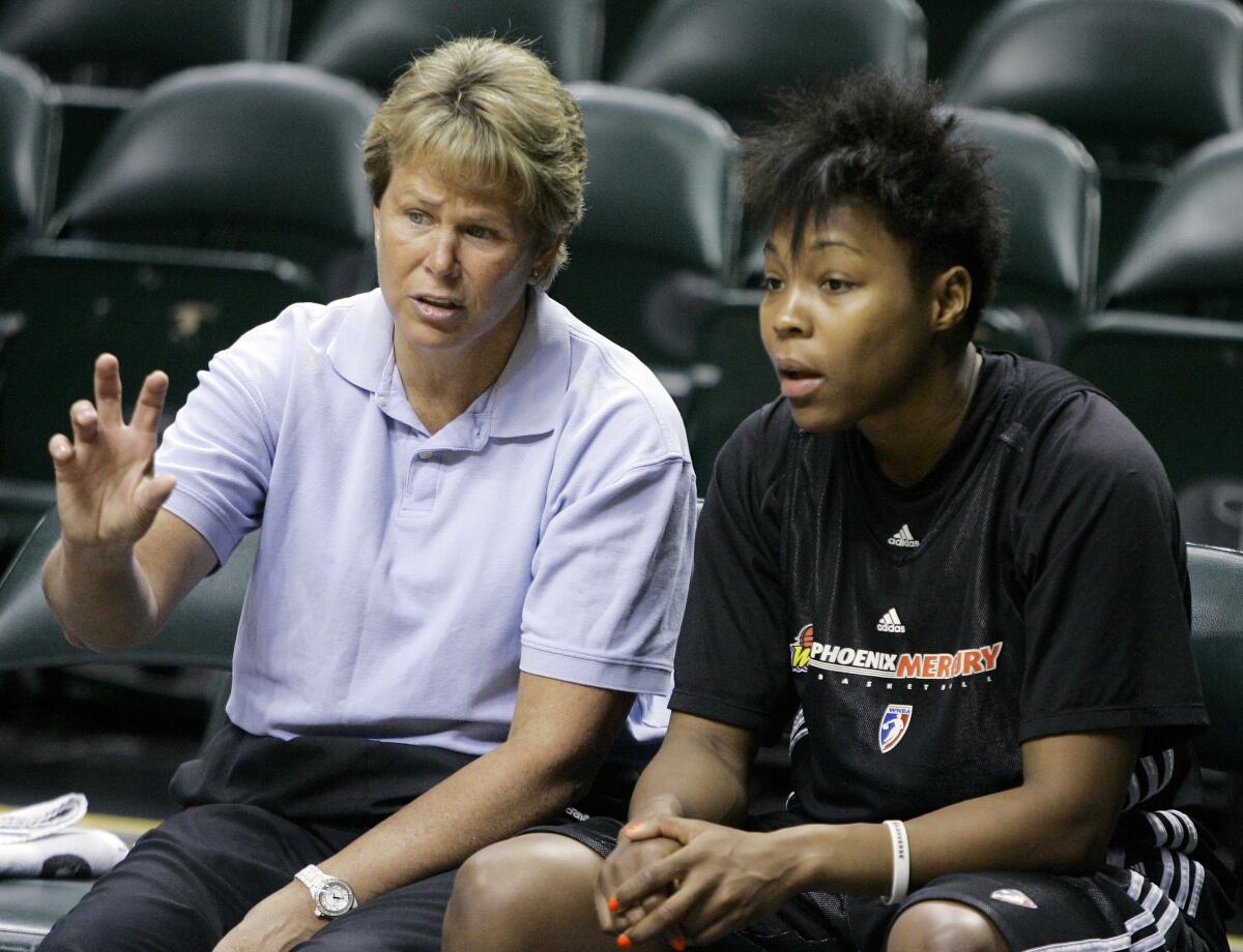 Phoenix Mercury general manager Ann Meyers Drysdale, left, talks with forward Cappie Pondexter before a WNBA Finals practice.