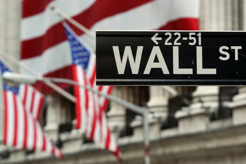 The Wall Street sign near the New York Stock Exchange on Aug. 5, 2011.