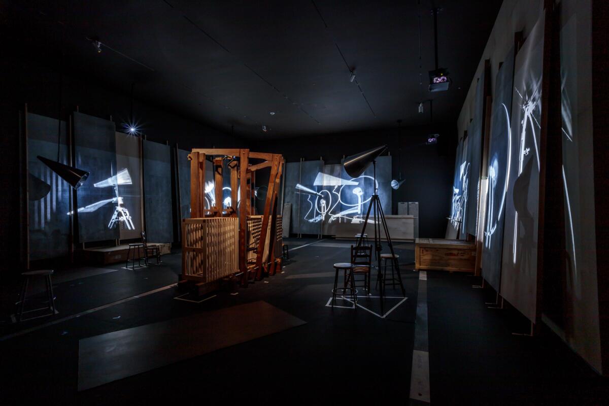 The "elephant" in William Kentridge's video-swathed room crosses an abstract loom with a breathing machine.