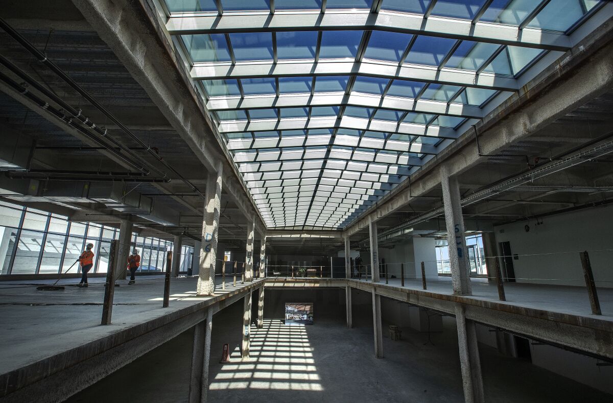 Sun shines through skylights in an empty building