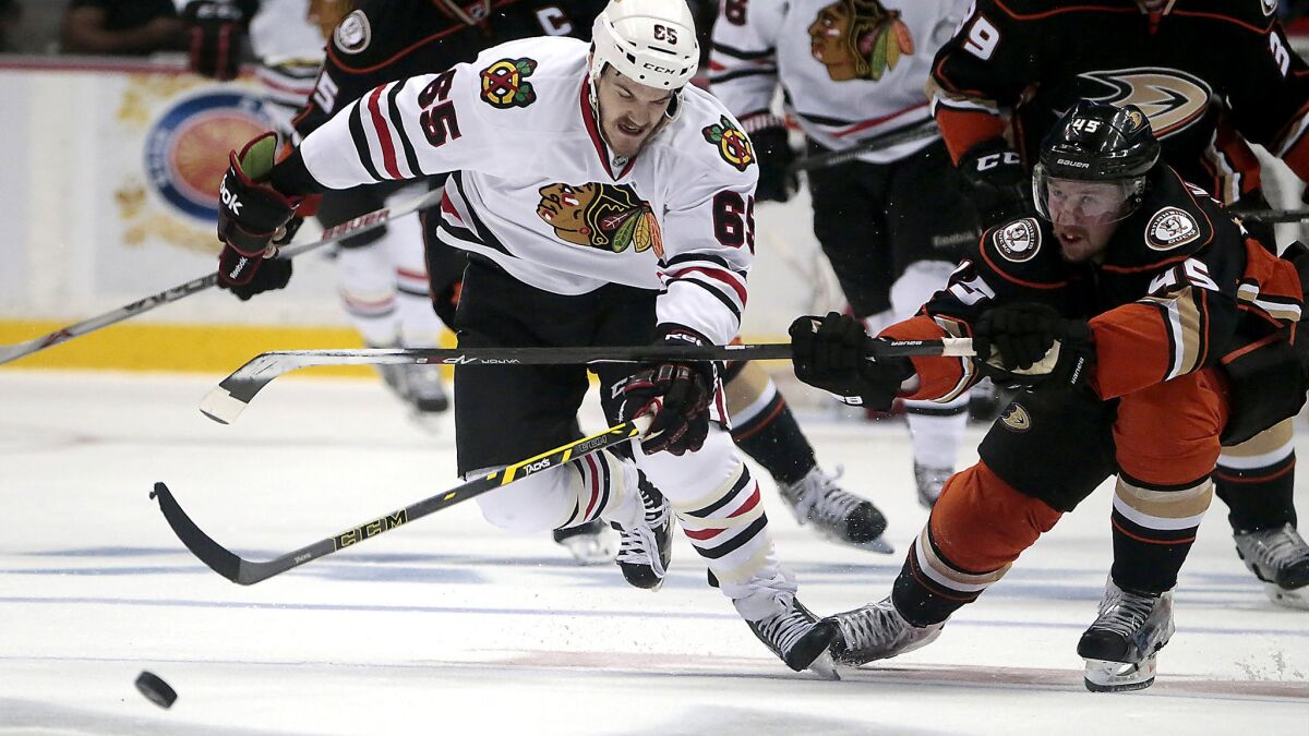 Blackhawks winger Andrew Shaw steals the puck from Ducks defenseman Sami Vatanen to start a breakaway in the second period of Game 7.