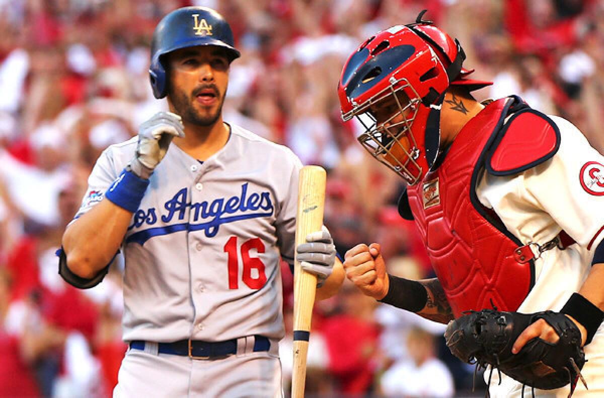 Cardinals catcher Yadier Molina pumps his first after Dodgers pinch-hitter Andre Ethier strikes out to end Game 2 of the NLCS on Saturday at Busch Stadium in St. Louis.