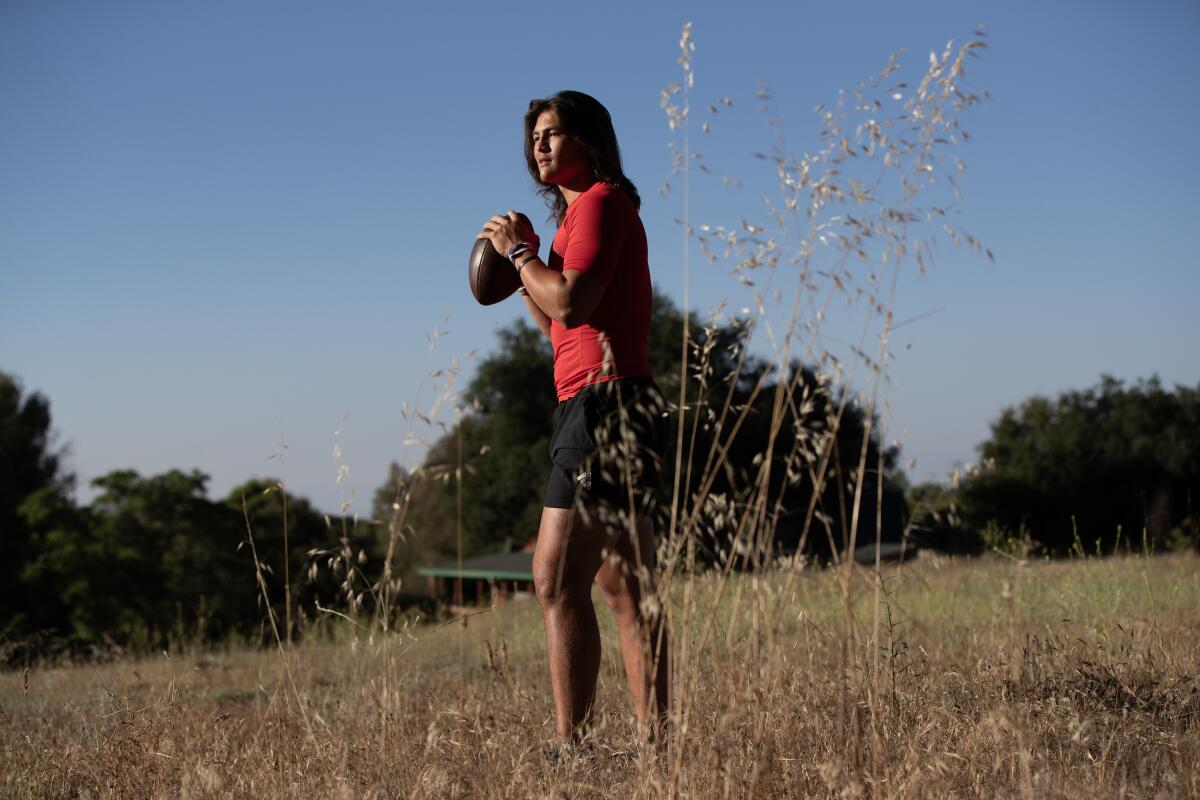 Murrieta Valley junior quarterback Bear Bachmeier poses for a photo on his family's three-acre plot of land.