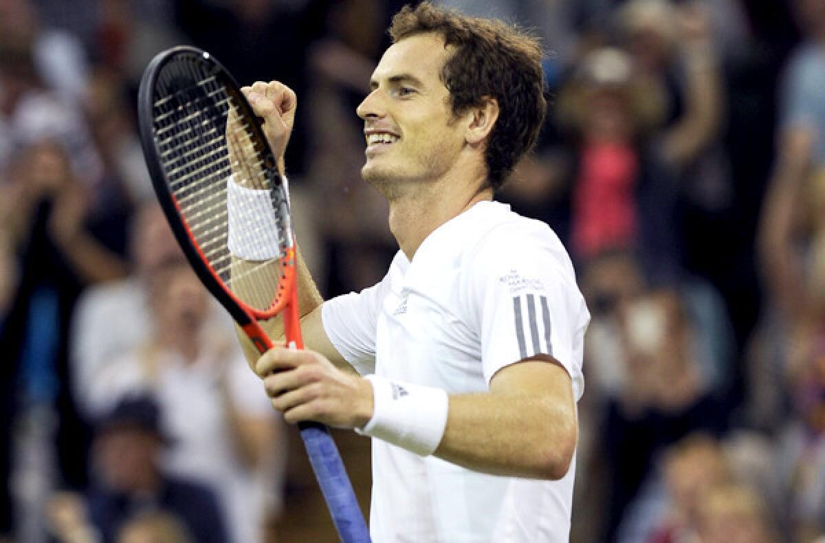 Andy Murray of Britain reacts after clinching a semifinal victory over Jerzy Janowicz of Poland on Friday at Wimbledon.